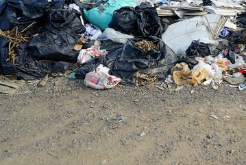 A pile of many plastic garbage on the ground, environmental pollution concepts.