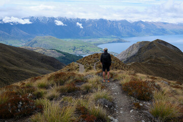 One person hiking in the mountains around queenstown, new zealand