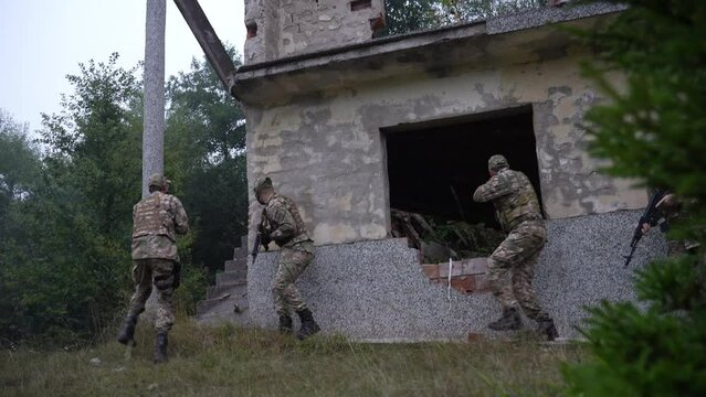 Military Squad Surrounds Ruined House