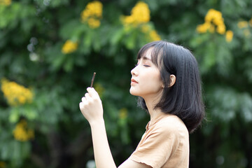 portrait of a woman with dandelion