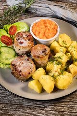 Pork tenderloin wrapped in bacon.