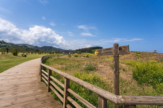 Directional sign on a wooden footpath  for the 'Camino de Santiago' a pilgrim route to Santiago de Compostella, Pobe&ntilde;a, Basque country, Spain