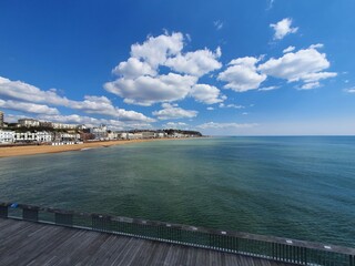 Obraz premium Various Pictures of the Coast at Hastings including the pier and the countryside park and a Cane Corso dog playing under the pier