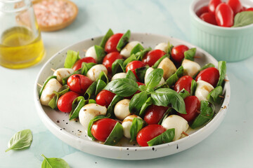 A plate with Italian salad caprese canape