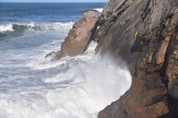 waves crashing on rocks