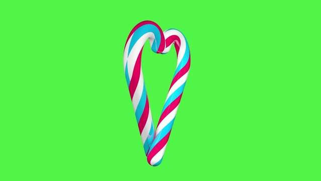 Christmas lollipops in the form of a heart on a green screen background. Seamless 3D animation. Christmas video effect. Christmas concept.