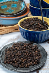 Indian spices collection, dried black peppercorns, kitchen spices