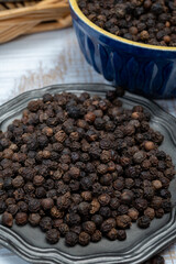 Indian spices collection, dried black peppercorns, kitchen spices