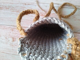 Beach bag made of lilac and white jute, crocheted
