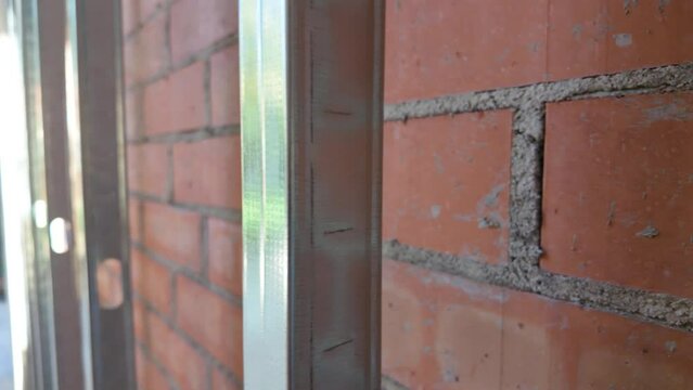 Metal structure for cavity wall insulation in walls and brick structure
