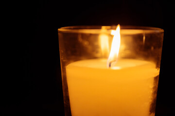 Close-up of Burning Candle on Dark Background, Concept of Inner Peace