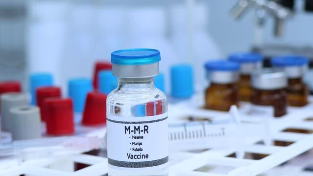 Measles, Mumps, Rubella vaccine in a vial, immunization and treatment of infection, scientific experiment