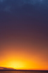 Soft sunset sky. Yellow, orange and purple gradient.