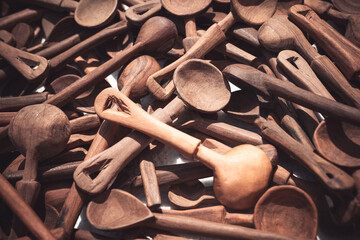 wooden spoons for sale at a weekly market