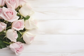 Greeting card for wedding with frame of white and pink roses  on white wooden background. Copy space