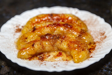 Traditional banana flambéed in butter and cinnamon powder