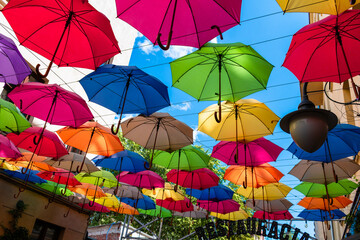 Fototapeta na wymiar colorful umbrellas in the stret