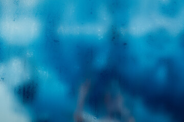 Condensation on the clear glass window. Water drops. Rain. Abstract background texture.