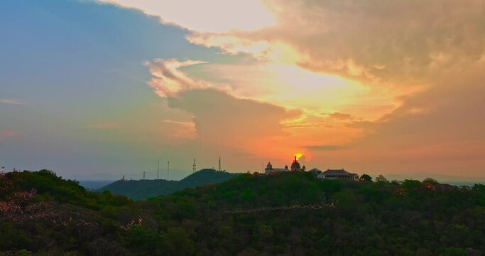 .Aerial view Huge, brightly colored clouds curled into a spiral above the castle..amazing cloud in bright sky at sunset above the palace on hilltop.Phetchaburi city background. cityscape background