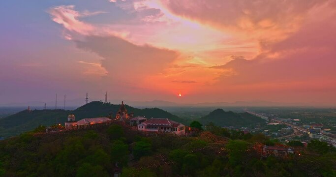 .Aerial view Huge, brightly colored clouds curled into a spiral above the castle..amazing cloud in bright sky at sunset above the palace on hilltop.Phetchaburi city background. cityscape background