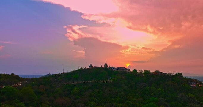 .Aerial view Huge, brightly colored clouds curled into a spiral above the castle..amazing cloud in bright sky at sunset above the palace on hilltop.Phetchaburi city background. cityscape background