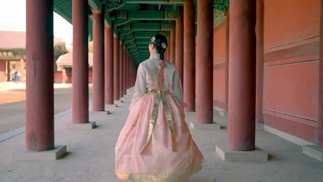 A graceful smile in traditional Hanbok at Changdeokgung palace, capturing the beauty of Korean culture