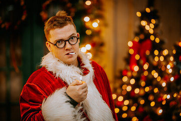 A pleased Santa Clause on vacations smokes a cigarette in cigarette. Bad Santa.