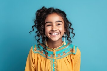 Smiling Indian Girl in Colorful Dress on Blue Background generative ai