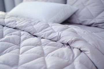 Fototapeta na wymiar White Folded Duvet on Bed. Preparing for Winter Season with Household Comfort and Hotel Luxury