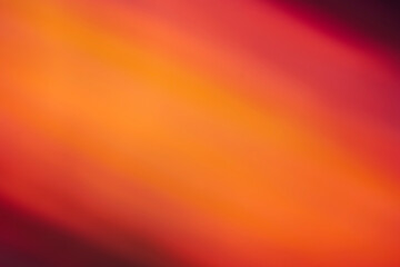 Abstract colorful red glowing background with defocused lights and gradient shadow.