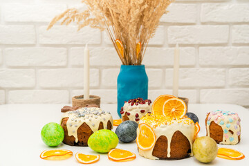 Set of traditional decorated easter cakes with icing and colored eggs. Symbol of holiday and Easter treat