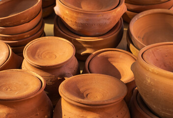 Handmade ceramic new empty craft ceramic plates, bowls and lids. Pottery Craft Ceramic Clay Pottery made by Human Hand.