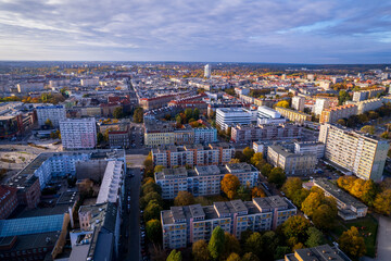 Szczecin from a bird's eye view on a sunny day. View of the city from the Oder River. City buildings, the seaport in Szczecin and its most characteristic places.