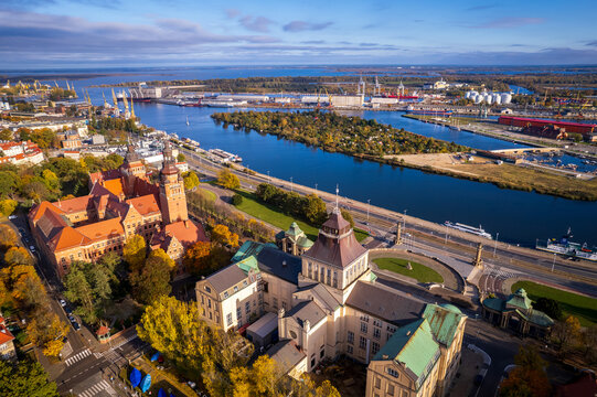 Szczecin from a bird's eye view on a sunny day. View of the city from the Oder River. City buildings, the seaport in Szczecin and its most characteristic places.