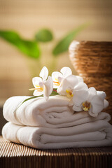 Obraz na płótnie Canvas Beauty spa treatment composition with towels and flowers