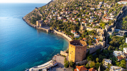 An aerial view of the Tersane beach bay Alanya in Antalya Turkey. Sea and city with an open sky....