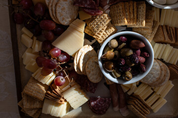 Close-up of a charcuterie board with cheese and crackers 