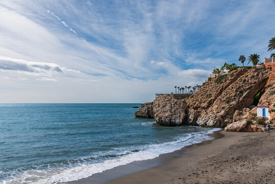 Carabeo Beach and the Balcon de Europa promenade in the background in the municipality of Nerja, Malaga.