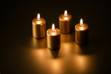 advent - Four golden Candles burning