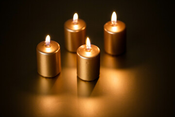 advent - Four golden Candles burning