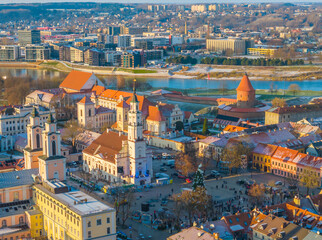 Aerial view of Kaunas old town in winter. Drone view of city center with churches, city hall and many historic red roof buildings