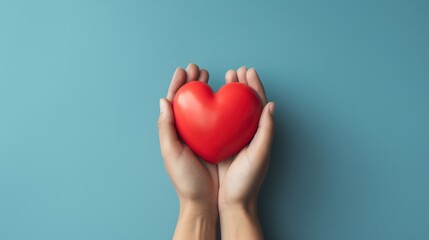 Hands Hold A Red Heart on the Minimalist Background

