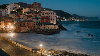 Long exposure Panorama of the little Italian town Boccadasse in the evening. Dramatic see and clear...