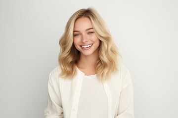 Young Attractive Fictional Norwegian Model Portrait. Beautiful Woman with Blond Hair and Blue Eyes in Casual Shirt Smiling Isolated on a Plain White Background. Generative AI.
