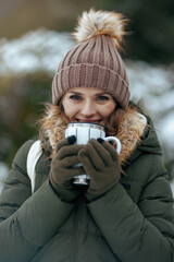 smiling 40 years old woman outdoors in park in winter