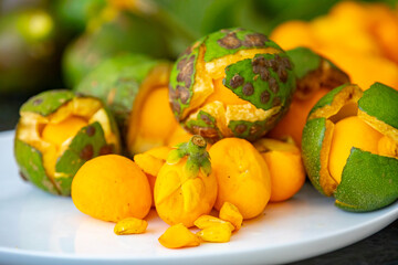 Typical ripe pequi fruit (caryocar brasiliense) in fine details and selective focus. Typical fruit from the Brazilian cerrado bioama.