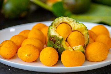 Typical ripe pequi fruit (caryocar brasiliense) in fine details and selective focus. Typical fruit from the Brazilian cerrado bioama.