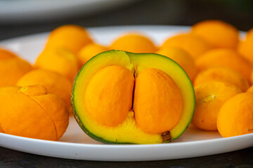 Typical ripe pequi fruit (caryocar brasiliense) in fine details and selective focus. Typical fruit from the Brazilian cerrado bioama.