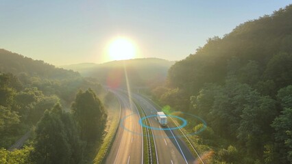 Scanning Delivery Truck Driving Through Empty Road With A Bright Sun. - aerial 