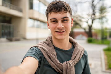 portrait of young Caucasian man teenager 18 or 19 years old outdoor